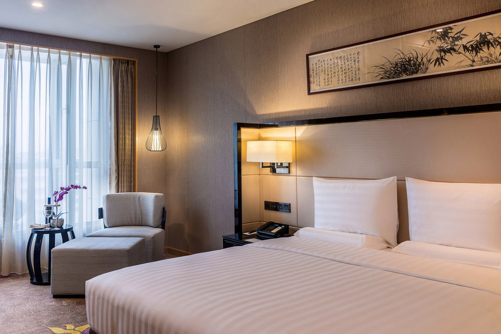 Отель Pullman Qingdao Ziyue Экстерьер фото