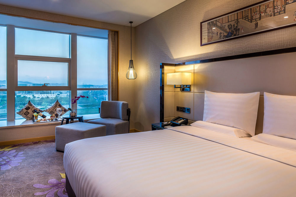 Отель Pullman Qingdao Ziyue Экстерьер фото