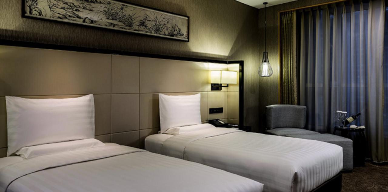 Отель Pullman Qingdao Ziyue Экстерьер фото