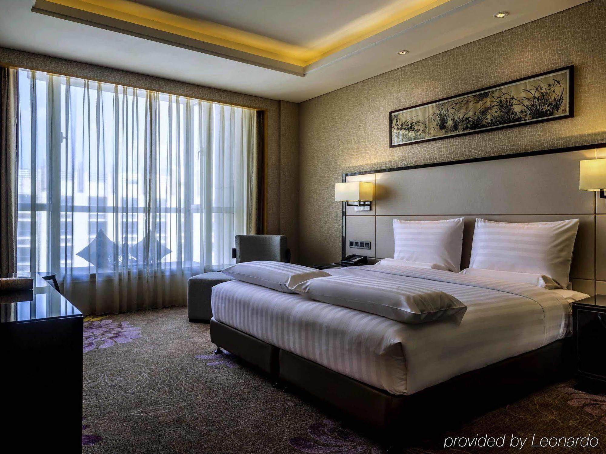 Отель Pullman Qingdao Ziyue Экстерьер фото