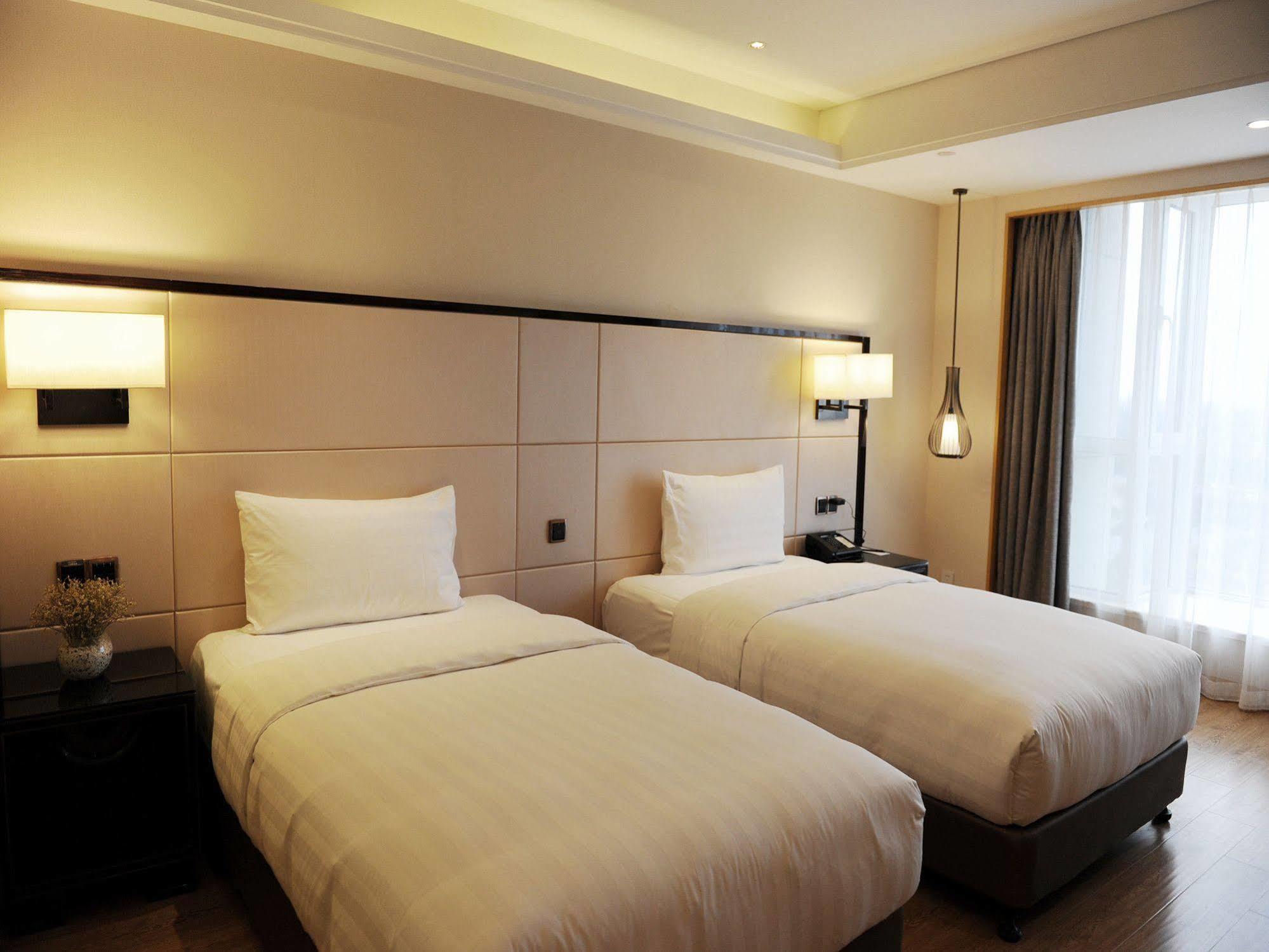 Отель Pullman Qingdao Ziyue Экстерьер фото